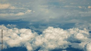Above the Clouds - Aerial Sky View, The serene beauty of a cloudy sky from above, a view often seen during air travel.
