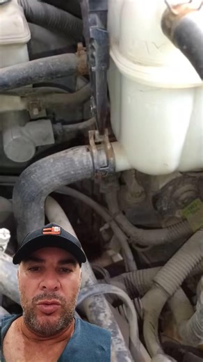 How do I remove the hose clamp from a reservoir using a fork?