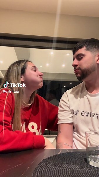 Couple's Cozy Moment in a Modern Kitchen Setting