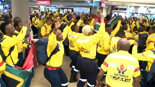 Firefighters from South Africa break into song and dance as they arrive in Alberta to help
