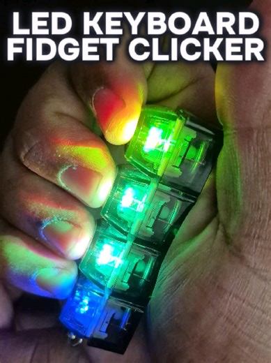 It’s basically a mini keyboard you can take anywhere. Four clickable keys with RGB LED lights that feel just like typing, and yes… it’s weirdly addictive. A lot of people use fidget-style clickers to stay focused, keep their hands busy, or just enjoy the sound and feel. Clips right onto your keys or backpack. You can grab it in the orange shopping cart. - #MackMotivates #TikTokShopCreatorPicks #FidgetToy #KeyboardClicker #DeskSetup