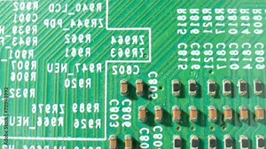 A Printed Circuit Board (PCB) is a thin board with conductive tracks that connect electronic components, making it a vital part of modern electronics. Macro video footage. Engineering concept.