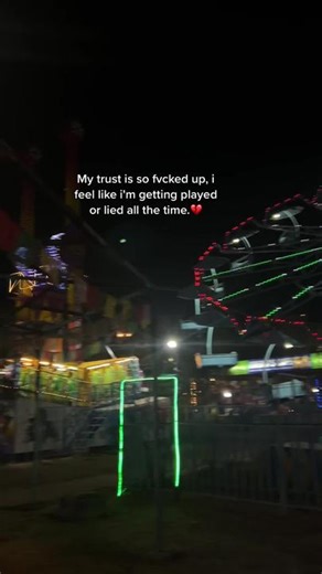 Nighttime Carnival Lights: Ferris Wheel and Rides