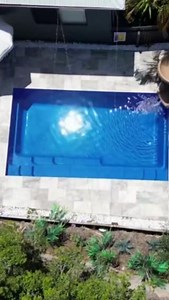 The Reflection in Sapphire Blue installed by #fibreglasspools #swimmingpools #fiberglasspools #swimmingpoolideas #poollandscaping #backyardpools #leisurepools #leisurepoolsau #leisurepoolsnz | Leisure Pools