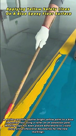 Applying Yellow Safety Lines On A Blue Epoxy Floor Surface
