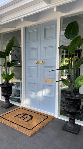 Our Front entrance DIY transformation Our front door is in fact a vintage Victorian state library door, I knew I had to upcycle it and give it a new lease of life. It wasn’t until we transformed our home’s exterior from brick to hardiplank that I started thinking seriously about the paint color for the front door. I chose the color “ol’ blue eyes” by @tint.paint to paint the door, it’s the perfect blue tone 🥹. We used a semi-gloss timber paint and a @wagnerspraytech spray gun to ensure a smooth