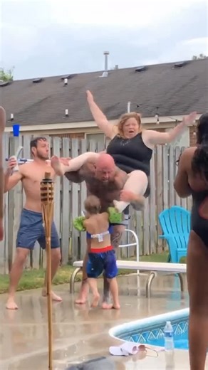 Viral News 🔥 on Instagram: "This is one of those moments that looks fun right up until it isn’t. Someone gets lifted onto shoulders on a wet pool deck — laughing, cheering, no concern at all. Then one slip changes everything. The footing gives out, balance is gone, and the person on top comes crashing down onto the hard pool edge before falling into the water. Pool decks are slick. Concrete doesn’t bend. And when someone is elevated, gravity has zero mercy. What people don’t realize is how dang