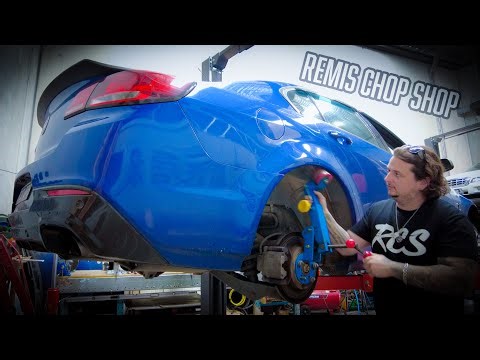 Guard Rolling A Holden Commodore At RCS Geelong
