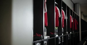 Change, interior and empty locker room with sport jersey, water bottle and fitness equipment. Soccer, gym and uniform at club with clothes, shoes and football cleats in dressing closet for storage