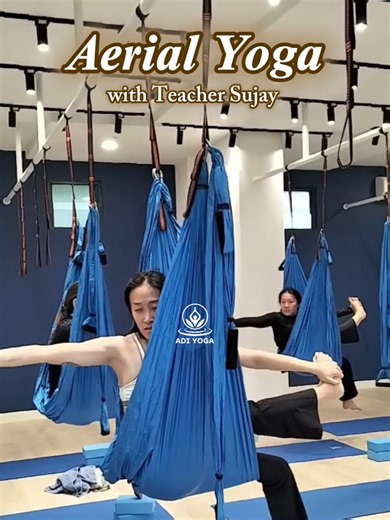 Aerial Yoga Class with Teacher Sujay Basak Benefits of Aerial Yoga : 1. Improves Flexibility and Strength : • Stretch deeper than on the floor. • Strengthens core, arms, shoulders, and back muscles. 2. Spinal Decompression : • Hanging upside down helps relieve pressure on the spine. • Reduces back pain and improves posture. 3. Enhances Balance and Coordination : • Being suspended challenges stabilizer muscles. • Improves body awareness and proprioception. 4. Reduces Stress and Anxiety : • Invers