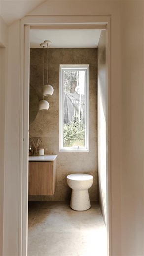 Featured tiles include Travertine French Pattern 12mm, Travertine Bullnose 406×610mm, Travertine Soft Stone, Botticino Square 100×100mm, Builders Range Travertino Bianco, and Mini Square Mosaics, complemented by Leyla Vancouver Pool Mosaic, CZ Wollombi Sandstone Random Cladding, and Manual Ash Subway 75×150mm. A restrained material palette that brings warmth, texture and architectural clarity throughout the home. #TravertineTiles #ArchitecturalMinimalism #StoneTileDesign #LuxuryInteriors #Bathro