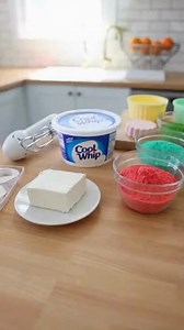 No-Bake Christmas Colorful Jello Cheesecake Bites Festive No-Bake Colorburst Jello Cheesecake Holiday Bites Recipe Ingredients: 8 oz cream cheese, softened 1 cup whipped topping (Cool Whip), thawed 1/3 cup powdered sugar 1 teaspoon vanilla extract 1 box (3 oz) assorted colorful Jello, prepared and finely diced 1 cup crushed vanilla sandwich cookies or graham crackers 1/2 cup white chocolate chips or melting wafers (optional) Holiday sprinkles (optional) Directions: In a medium bowl, beat the sof