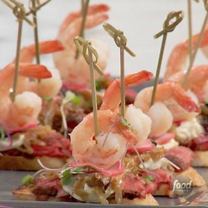 1.1M views · 4.1K reactions | Surf and Turf Crostini with rib-eye and shrimp is the best of both worlds on a slice of baguette. (via Jeff Mauro) | Food Network | Facebook