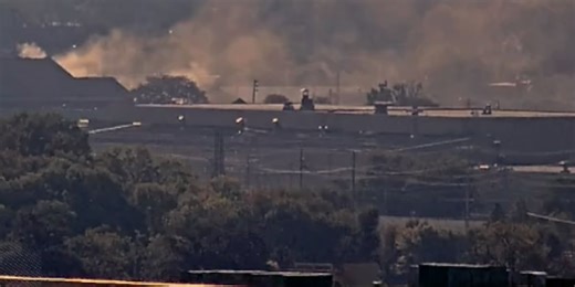 Train hits Moline ladder truck as crews fight fire at machine shop