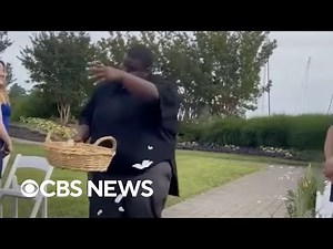 Flower man dances down wedding aisle