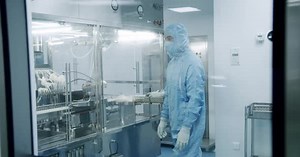 Medical Lab Workers in Clean Suits