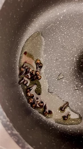 Cooking Techniques: Stirring Seeds in a Non-Stick Pan