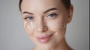 Woman face close up beauty eyes lips skin beautiful young female model face looking camera