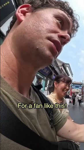Buying a fan on the streets of Beijing