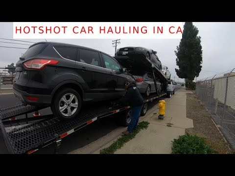 Transporting four repo cars, Loading non-running SUV.