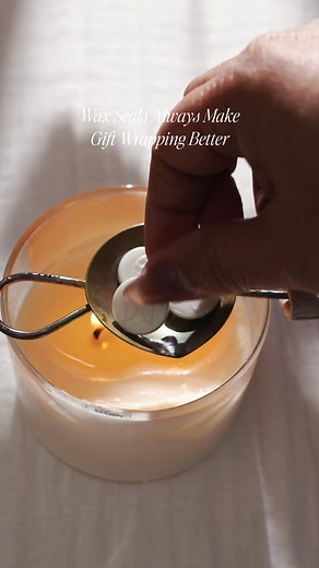 1.3M views · 13K reactions | Wax seals are a present's best friend ❤️ Elevate your holiday cards and gifts with a handcrafted touch. For this gift wrap, we marbled Silver and Baby Blue into Antique Pearl sealing wax, then stamped it with our By Candlelight design for a minimal, elegant finish. | Artisaire | Facebook