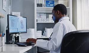 Doctor reviewing patient's medical data on a computer