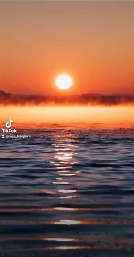 Serene Sunrise Over Water with Motivational Text