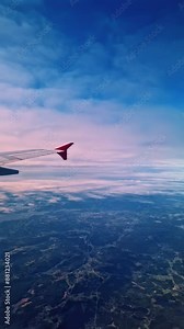 Bird's-eye view of Sweden from airplane, showcasing vast landscapes and serene skies. Ideal for travel, geography, and nature projects. Vertical video