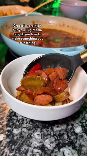 This bowl of sausage and peppers over potatoes was cheap to make!