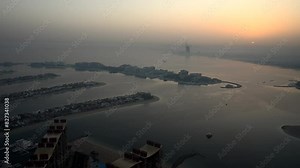 Flying over a body of water during a plane journey, capturing the scenery below