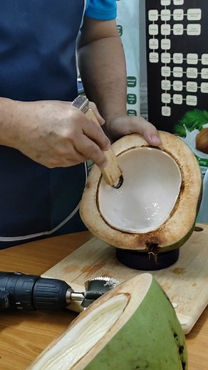 Scraping young coconut meat via young coconut meat manual scraper ( wooden handle U scraper). #cocoman #coconutmachine #coconutmachines #youngcoconutmanualscrapper #scrappingtool