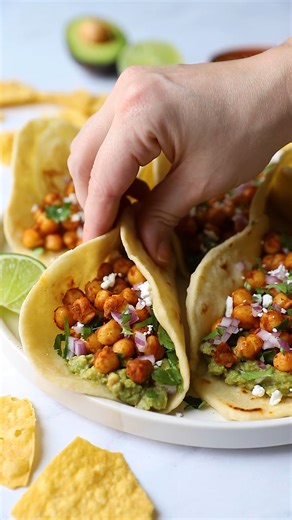 Bringing you my favorite vegan tacos that are insanely delicious and so easy to make! These Chickpea Tacos are hearty, healthy, and ready in less than 20 minutes. The perfect plant-based, gluten-free lunch or dinner! ingredients 2 cans of chickpeas, drained rinsed and dried 1 1/2 tablespoons of olive oil 2 teaspoons of cumin 1 teaspoon of chili powder 1/2 teaspoon of salt 1/2 teaspoon of black pepper 1/4 teaspoon of oregano 1/2 teaspoon of paprika 1/4 cup of water For serving: tortillas, guacamo