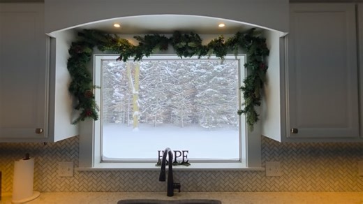 The winter wonderland view from our kitchen window. These are my favorite trees covered in snow! | Jonathan Cox