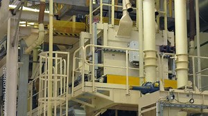 Workshop for the production of particle boards. Manufacture of chipboard, veneer, plywood, wood panels. Wood processing. Woodworking industry. Plywood production at the factory, conveyor and workshop