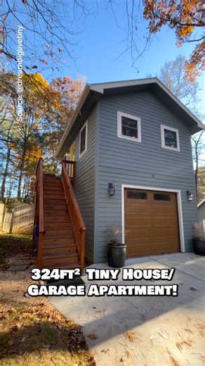 What do you think of this 324-sqft tiny house above a garage? Would you live in this home? Comment GARAGE & I'll message you more pictures & info! This tiny house located in Asheville, North Carolina features a cozy living space with a couch & TV, a kitchen with apartment-size appliances & a bartop for 2, a private bedroom with drawers underneath the bed, & a spacious bathroom with a tile shower! I had the pleasure of staying in this pet-friendly tiny house through Airbnb, & while I love the flo