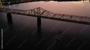 Good dusk aerial establishing shot of Louisville, Kentucky downtown skyline, with George Rogers Clark Memorial Bridge in foreground.