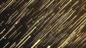 Abstract background animation with glittering shiny gold particles and shooting golden stars. This luxury shiny glamorous awards ceremony motion background animation is full HD and a seamless loop.