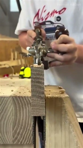Craftsman Using Router Tool for Precise Wooden Edge Trimming