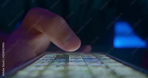 Man's hand browsing internet social media scrolling internet pages on mobile phone in evening closeup. Finger of young man scroll page app on mobile phone and Browse Social Network Close up.