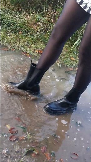 Cleaning my boots in a puddle