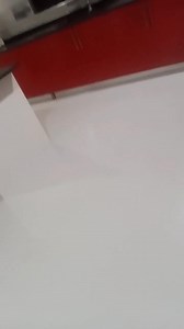 A residential kitchen transformed with a modern, seamless epoxy flooring finish—combining durability with clean aesthetics. | Premier Flooring Systems Ghana