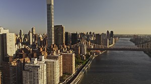 NYC New York Aerial v390 drone flyover East river along FDR drive capturing riverside traffic, Midtown Manhattan and Upper East Side cityscape at sunrise - Shot with Mavic 3 Pro Cine - September 2023 | Premium Stock Video Footage