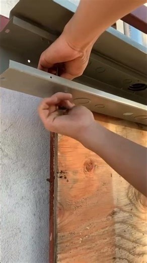 Removing three knockouts on a electrical junction box and installing EMT connectors