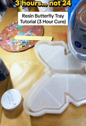 Resin tutorial: how to create a resin butterfly tray design with a 3-hour cure machine This process breaks down step by step: \t1.\tPour your base layer of resin into the mold \t2.\tPlace your stones by section (pink, gold center, blue wing) \t3.\tAdd glow-in-the-dark stars for detail \t4.\tPour your top layer to seal everything in \t5.\tCure — this only took 3 hours using a curing machine. Resin used: Promise epoxy resin (in my showcase) also resin bucket kit 3-hour curing machine: also in my s