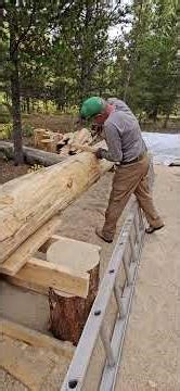 Scott Screws Supports Into Log Rafter to Level Ladder for Alaska Chainsaw Mill