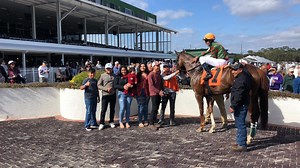 Apprentice jockey Christian Maragh relishes the moment after winning the 4th race on 4-year-old Florida-bred gelding Wizardofez, a 12-1 shot. The winner is owned by Glen S. Lostritto and trained by Hernan Parra. | Tampa Bay Downs, Inc.