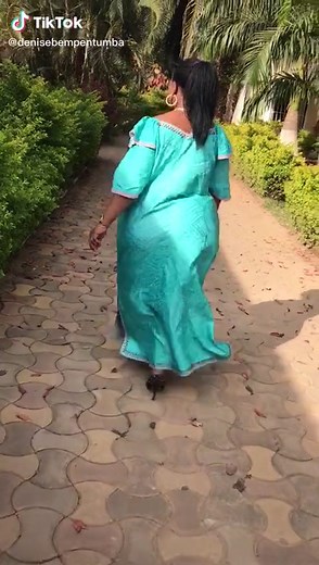 Exploring Tropical Beauty in Traditional Teal Dress
