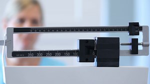 Woman On Scale At Doctors Office Stock Footage SBV-347614786 - Storyblocks