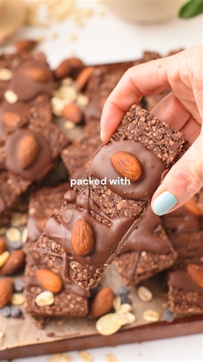 Carine Claudepierre on Instagram: "🙏Comment 'RECIPE' and I'll DM you the recipe for These Chocolate Granola Bars are crazy easy bars, ready in just about 20 minutes with basic ingredients, and they bring 6 grams of protein and 3 grams of fiber each, but no refined sugar. . recipe linked in bio and on my website: https://www.theconsciousplantkitchen.com/chocolate-granola-bar/ . #snack #easysnack #healthysnack #healthyrecipes #healthysweets #healthytreats"