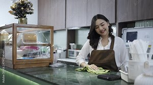 Happy, smiling, Portrait attractive asian waitress counter preparing workplace and wipe dust before welcome customer, Female cleaning counter desk wiping it with washcloth in coffee shop Stock Video